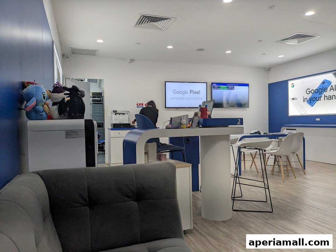 Interior of a Google Pixel Authorized Service Centre with a reception desk and seating area.