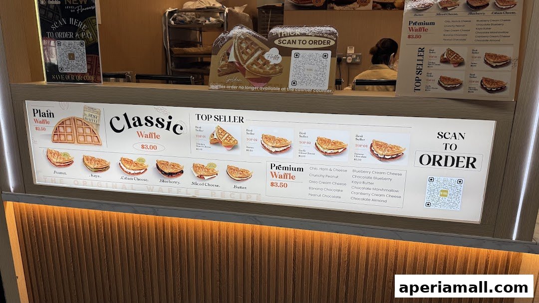A brightly lit menu board displaying various waffle options and their prices.