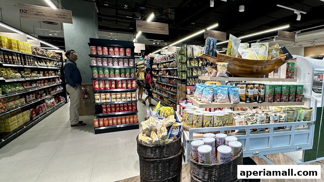 A man browses shelves stocked with various food products in a well-lit supermarket aisle.