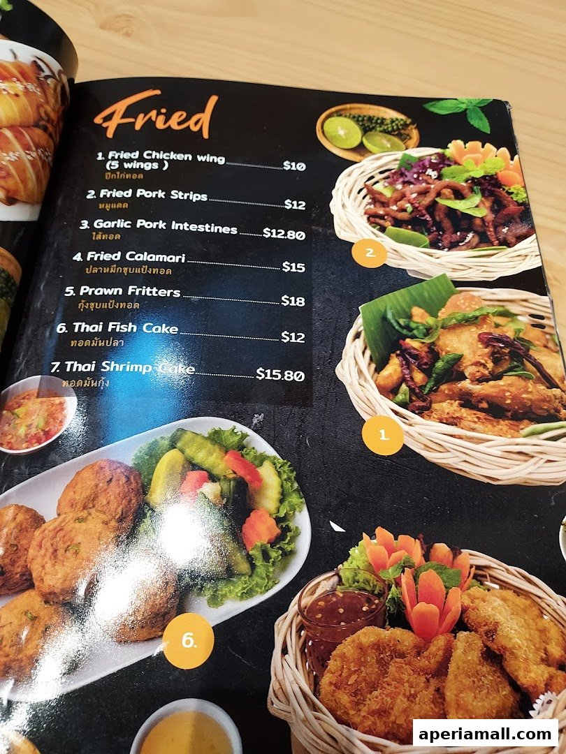 A menu page from Im-Em Thai Kitchen featuring a selection of fried Thai dishes with prices.