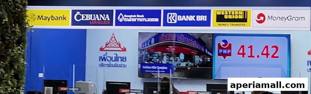 A shop front displaying various money transfer services and exchange rates.
