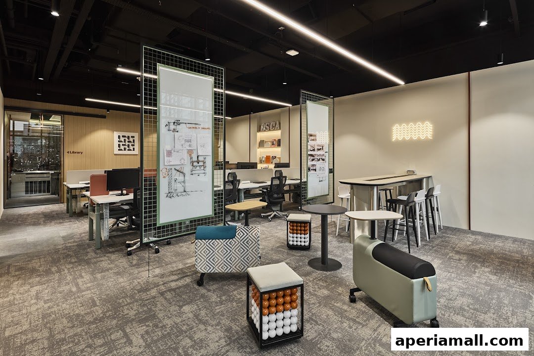 Modern office interior with workstations, meeting areas, and unique seating.