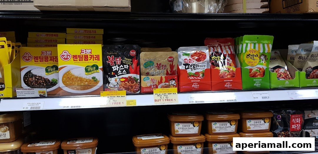 Shelves stocked with various Korean food products, including sauces, pastes, and instant meals.