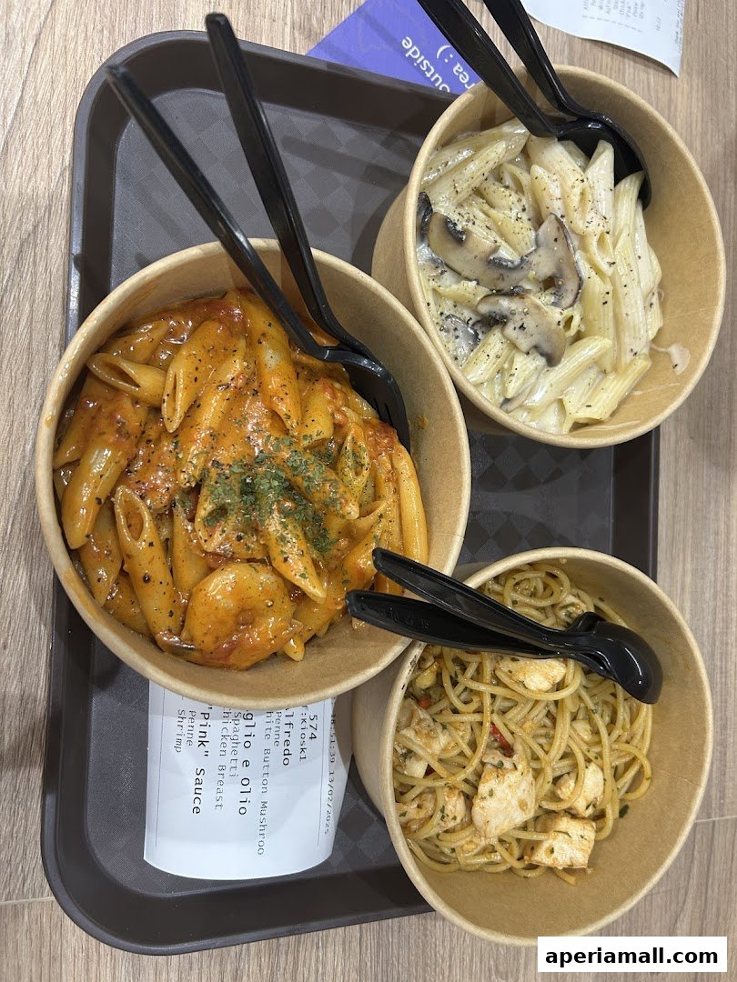 Three bowls of pasta, including penne with tomato sauce, penne with cream sauce and mushrooms, and spaghetti with chicken.