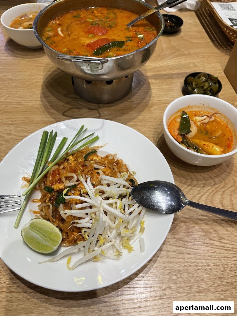 A close-up of Pad Thai and Tom Yum soup, showcasing authentic Thai cuisine.