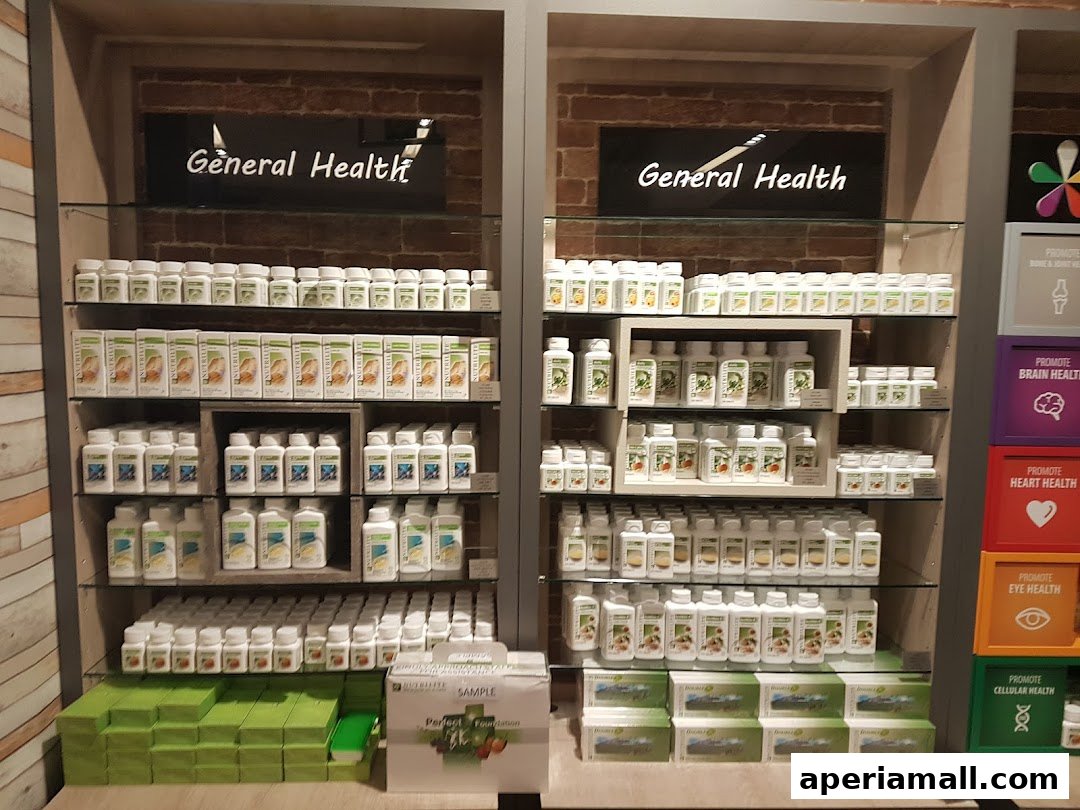 A retail display showcasing various Nutrilite health supplements and products on shelves.