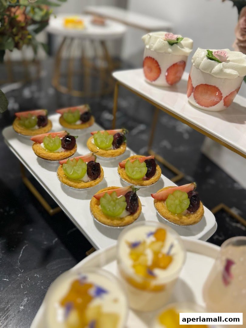 A display of assorted fruit tarts and strawberry desserts from Aimer La Patisserie.