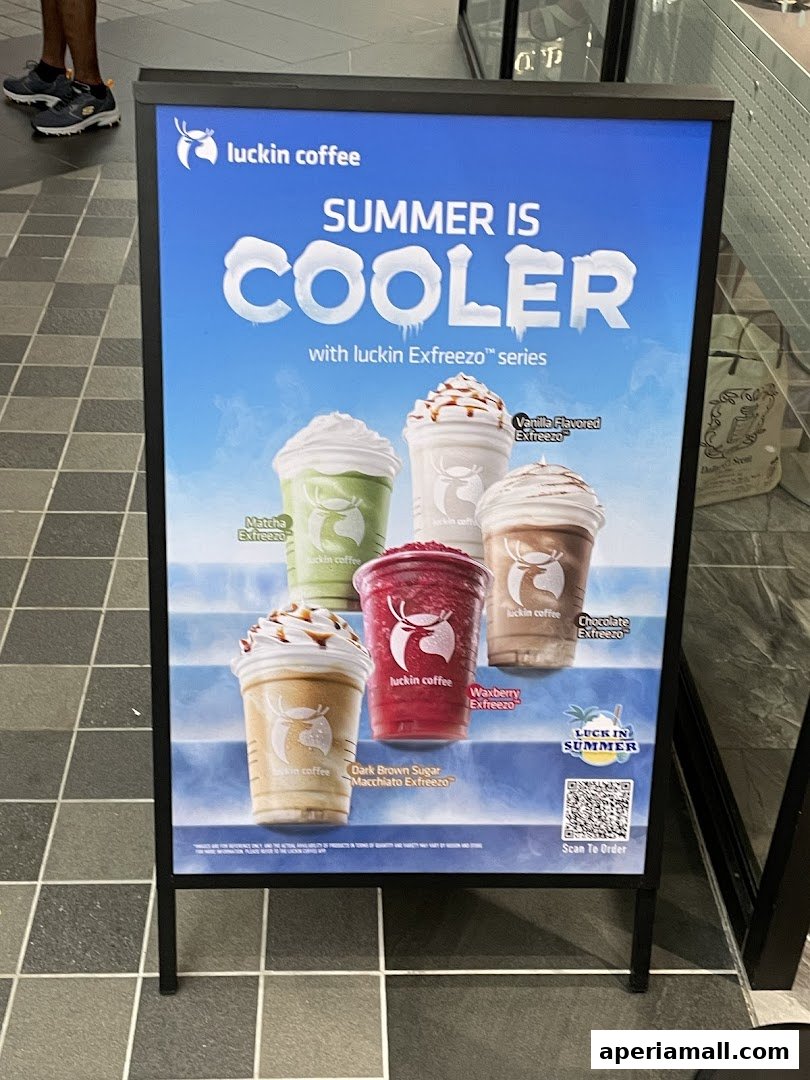 A-frame sign advertising Luckin Coffee's summer Exfreezo series with various drink options.