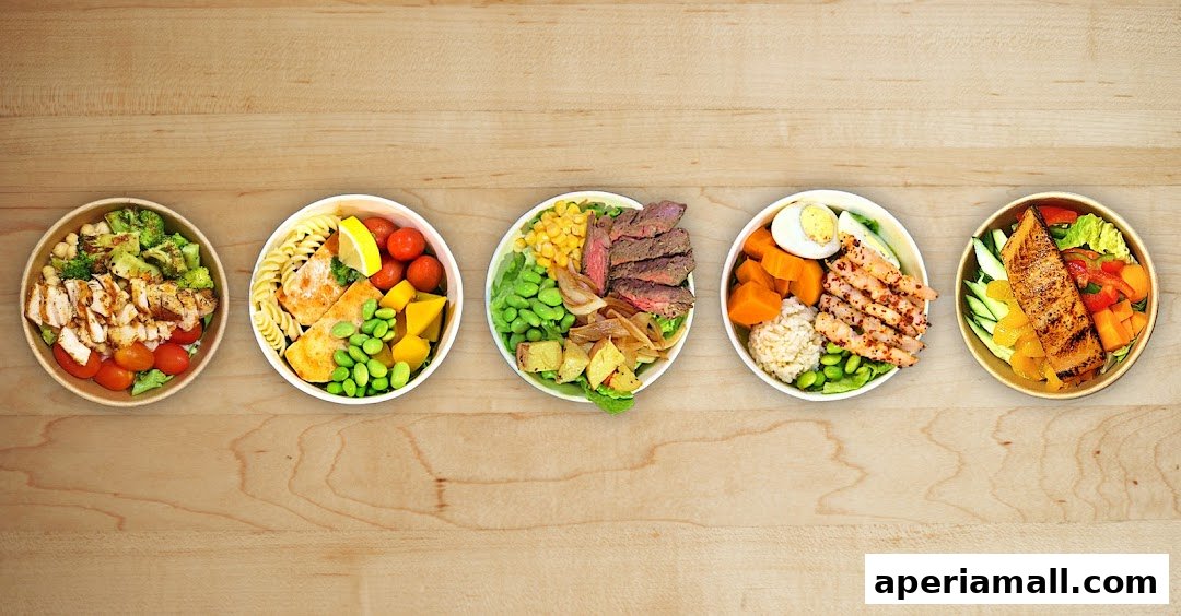 Five colorful and healthy salad bowls with various proteins and vegetables arranged on a wooden surface.