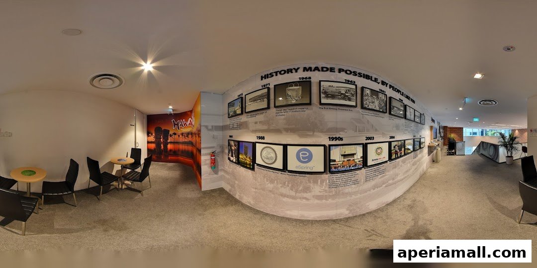 Interior view of a shop with a historical timeline display and seating area.