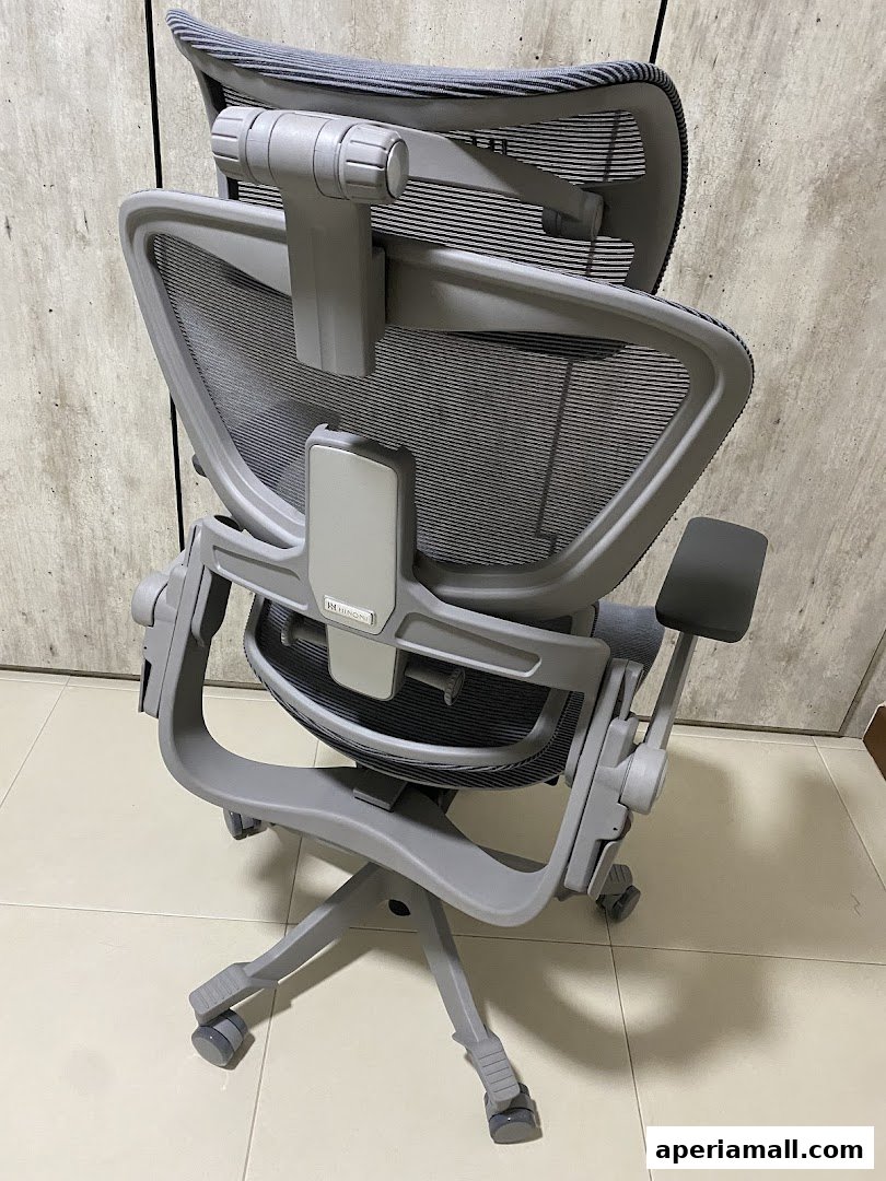 A grey ergonomic office chair with mesh back and adjustable armrests is shown.