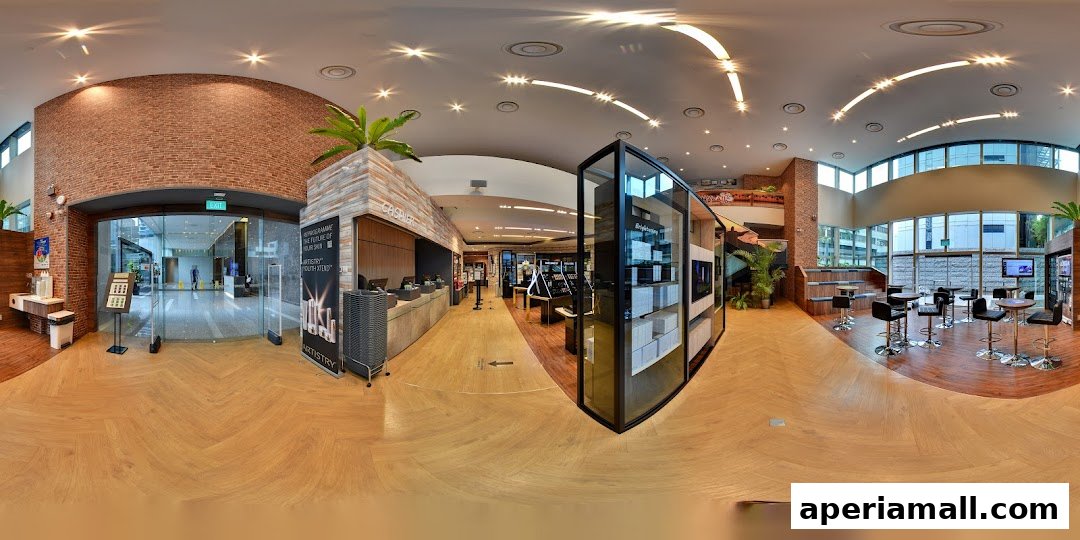 Interior view of a modern retail store with product displays, seating area, and cashier counter.