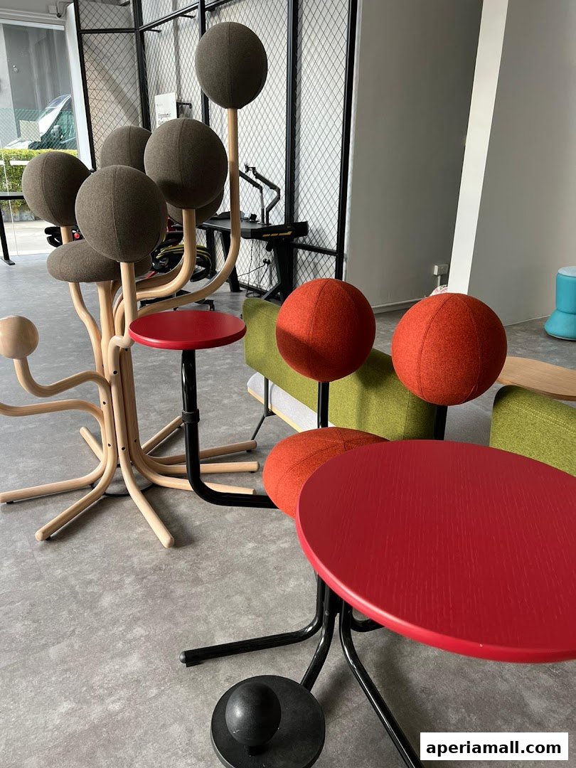 Interior shot of a showroom featuring unique, spherical-topped chairs and tables.