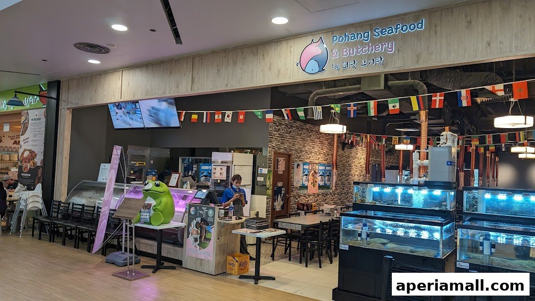 Pohang Seafood & Butchery shop front with seafood tanks, seating, and a staff member at the counter.