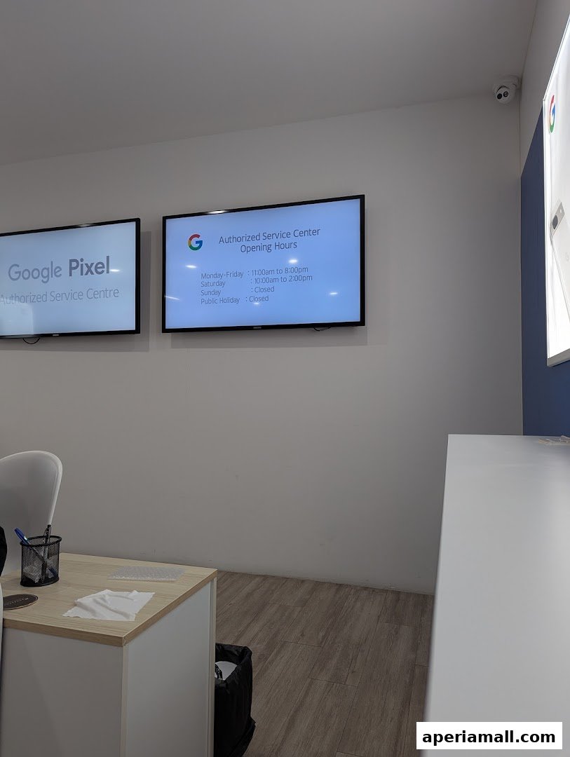 Interior of a Google Pixel Authorized Service Centre with screens displaying information.