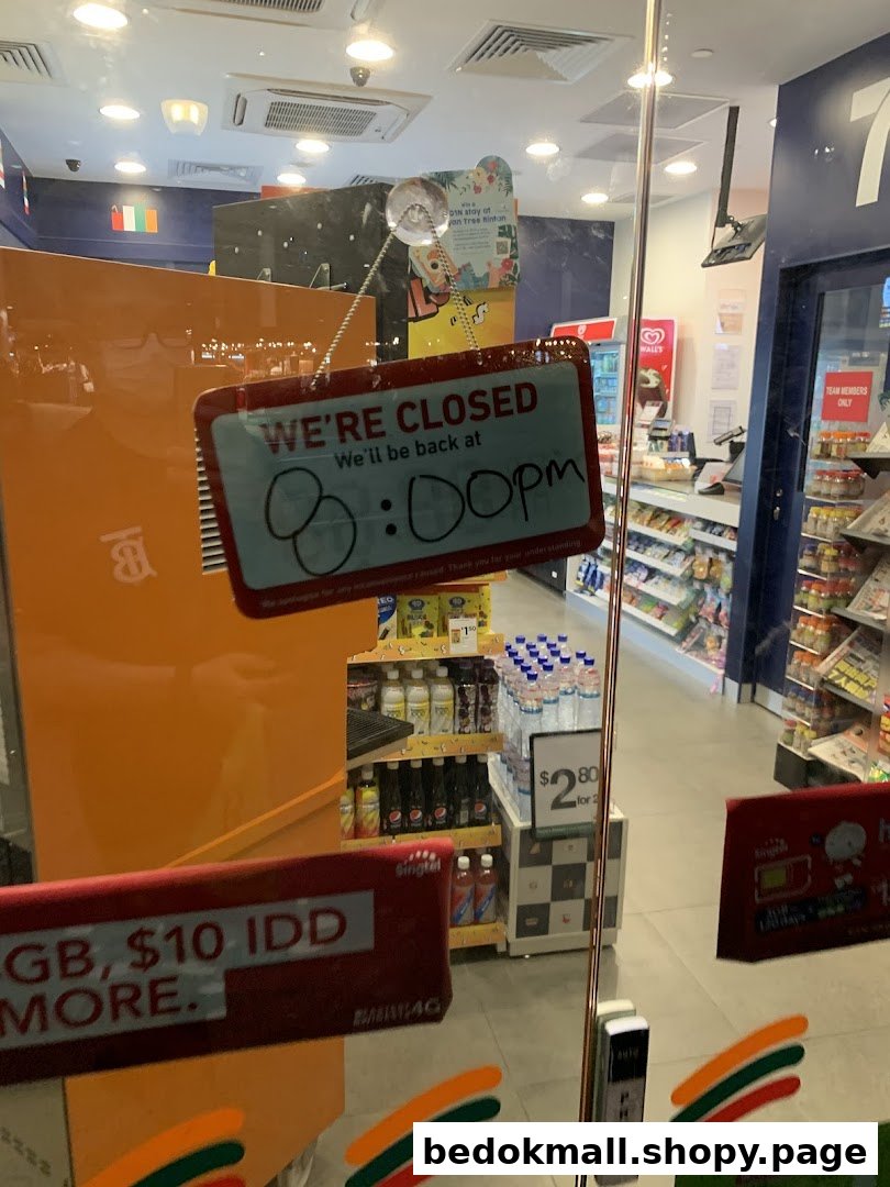 A 7-Eleven shop entrance with a 'We're Closed' sign on the glass door.