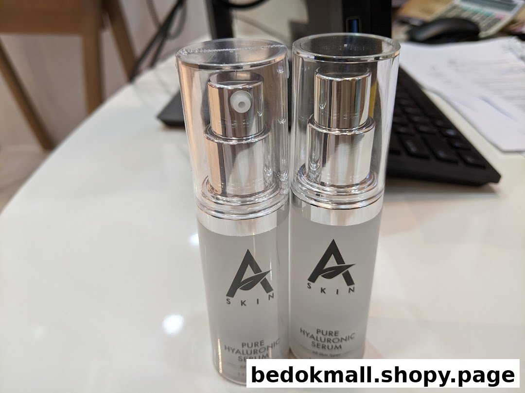 Two bottles of A Skin Pure Hyaluronic Serum on a white desk.