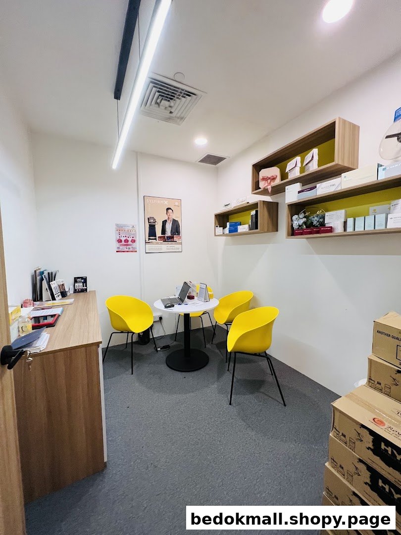 Interior view of a shop with a waiting area, product shelves, and stacked boxes.