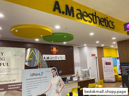 Interior view of A.M Aesthetics reception area with promotional displays and desk.