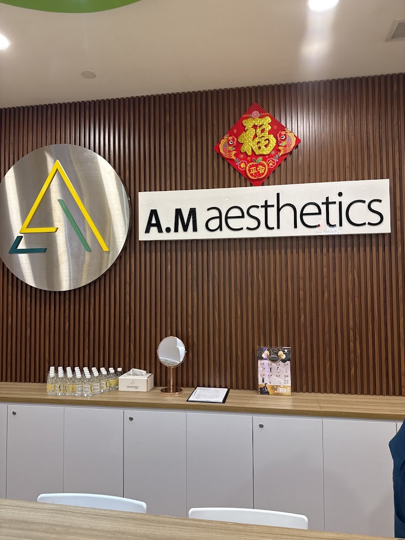 Interior view of A.M Aesthetics reception area with logo and counter.