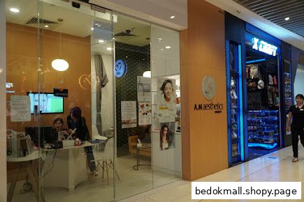 Shopfront of A.M Aesthetics with glass entrance and visible interior.