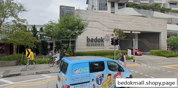 Exterior view of a large building with 'Bedok Residences' signage, street, people, and a blue van.