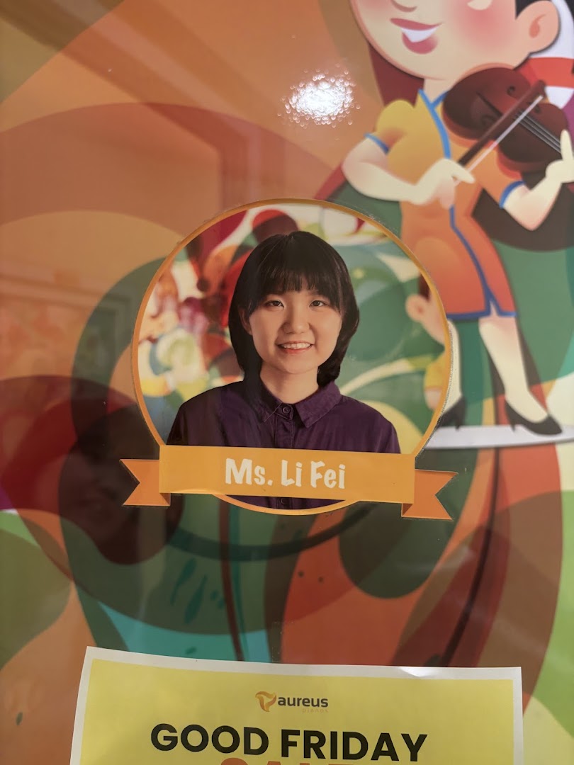 Poster featuring a photo of Ms. Li Fei, a cartoon violinist, and a Good Friday sign.