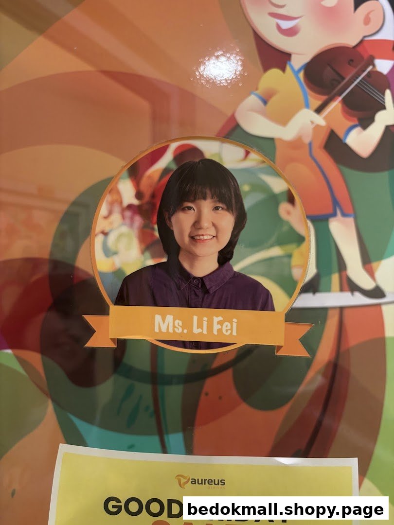 Poster featuring a photo of Ms. Li Fei, a cartoon violinist, and a Good Friday sign.