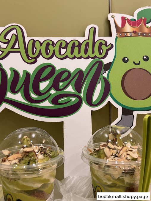 Avocado desserts displayed with an 'Avocado Queen' sign.