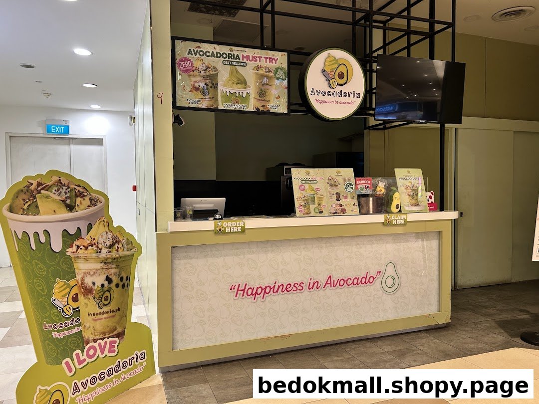 Avocadoria shop counter with menus, a large product standee, and ordering area.