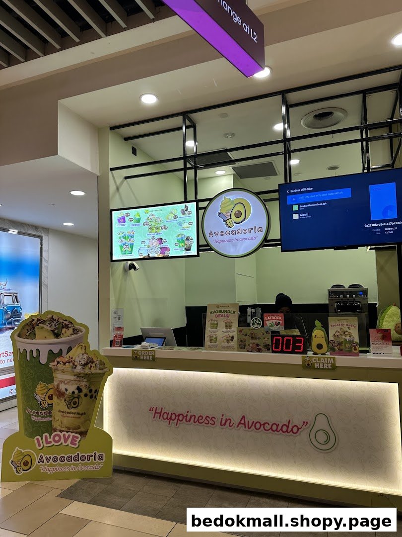 Interior view of Avocadoria's counter with menu and product displays.