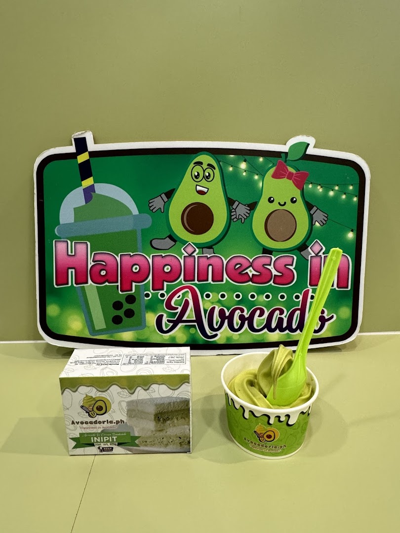 Avocado-themed sign with avocado soft serve and a product box.