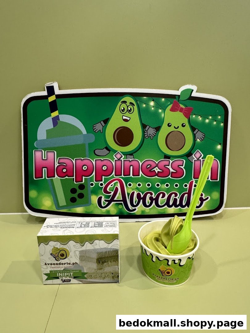 Avocado-themed sign with avocado soft serve and a product box.