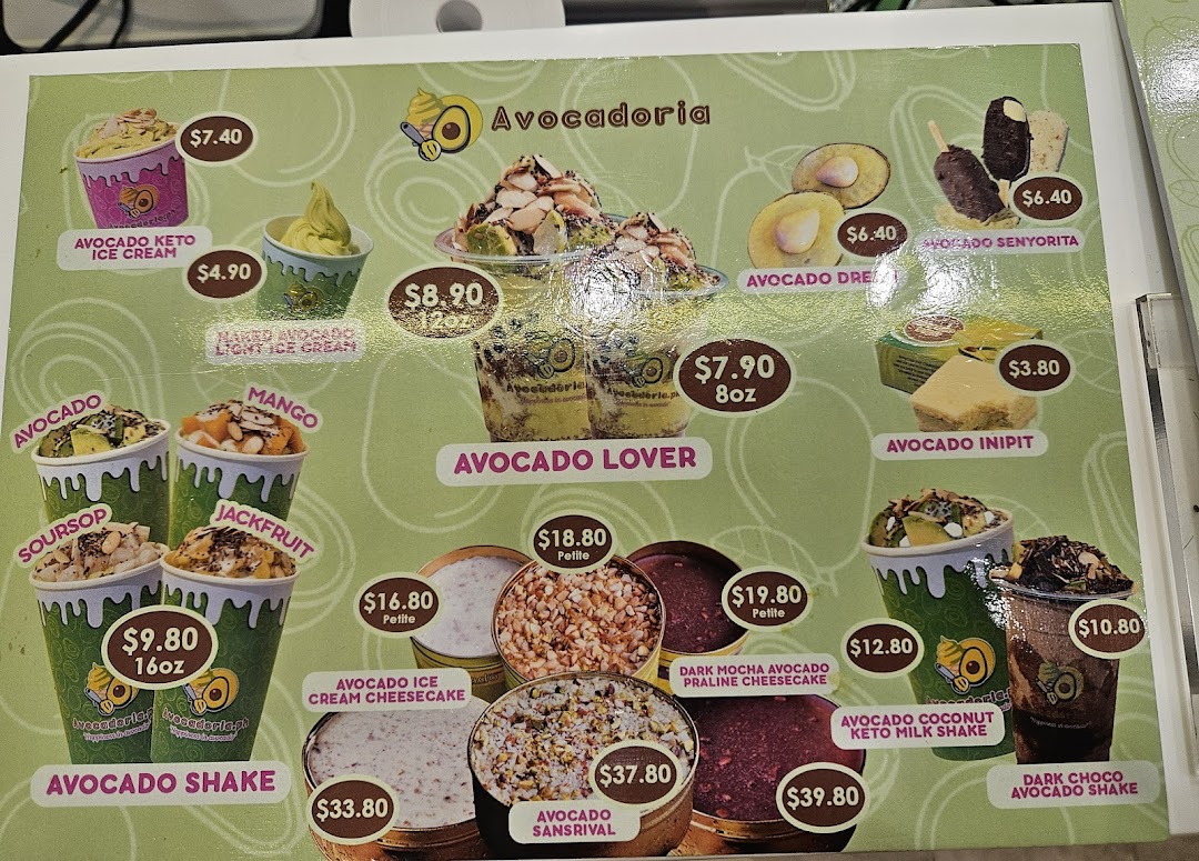 A vibrant menu displaying various avocado-based desserts, ice creams, shakes, and cakes from Avocadoria.