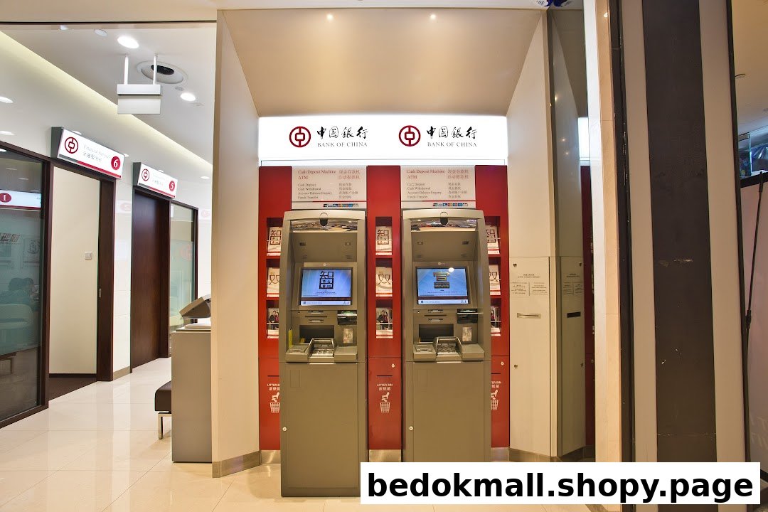 Interior view of a Bank of China branch with two ATMs and service counters.