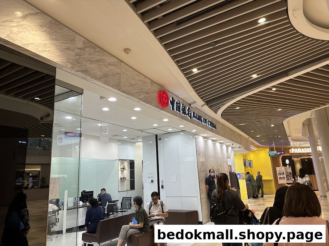 Bank of China entrance with people inside a brightly lit mall.