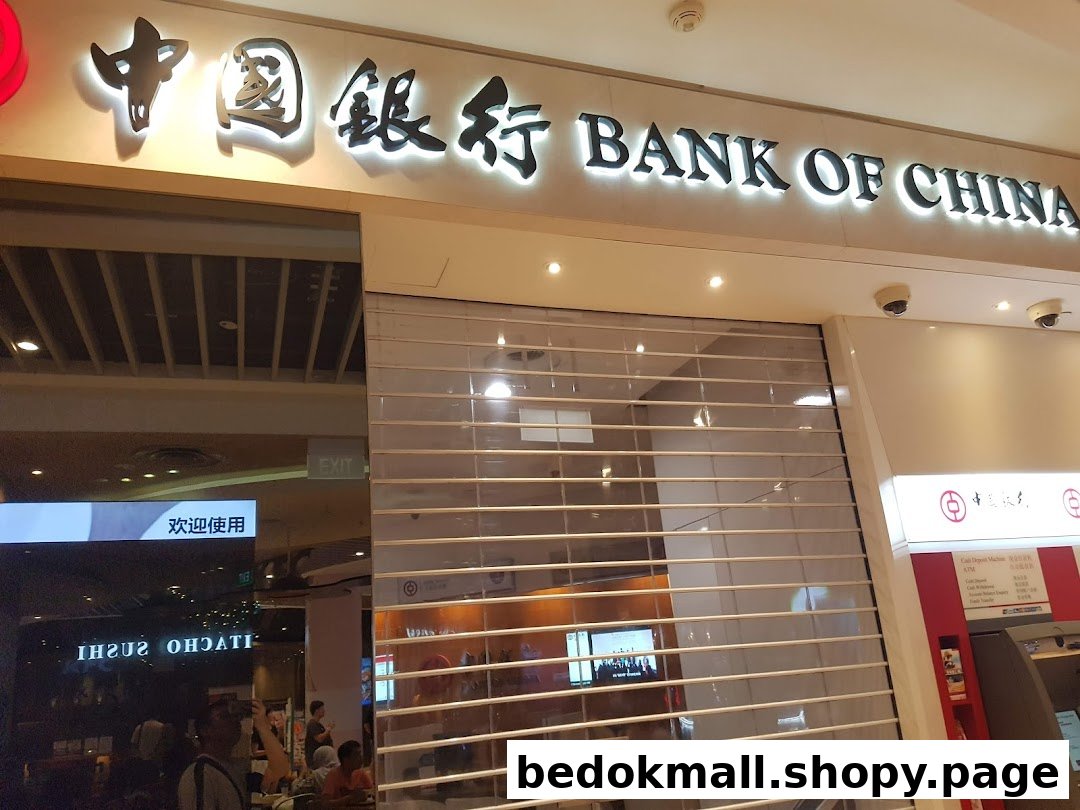 Exterior view of Bank of China branch with closed security shutter and ATMs.