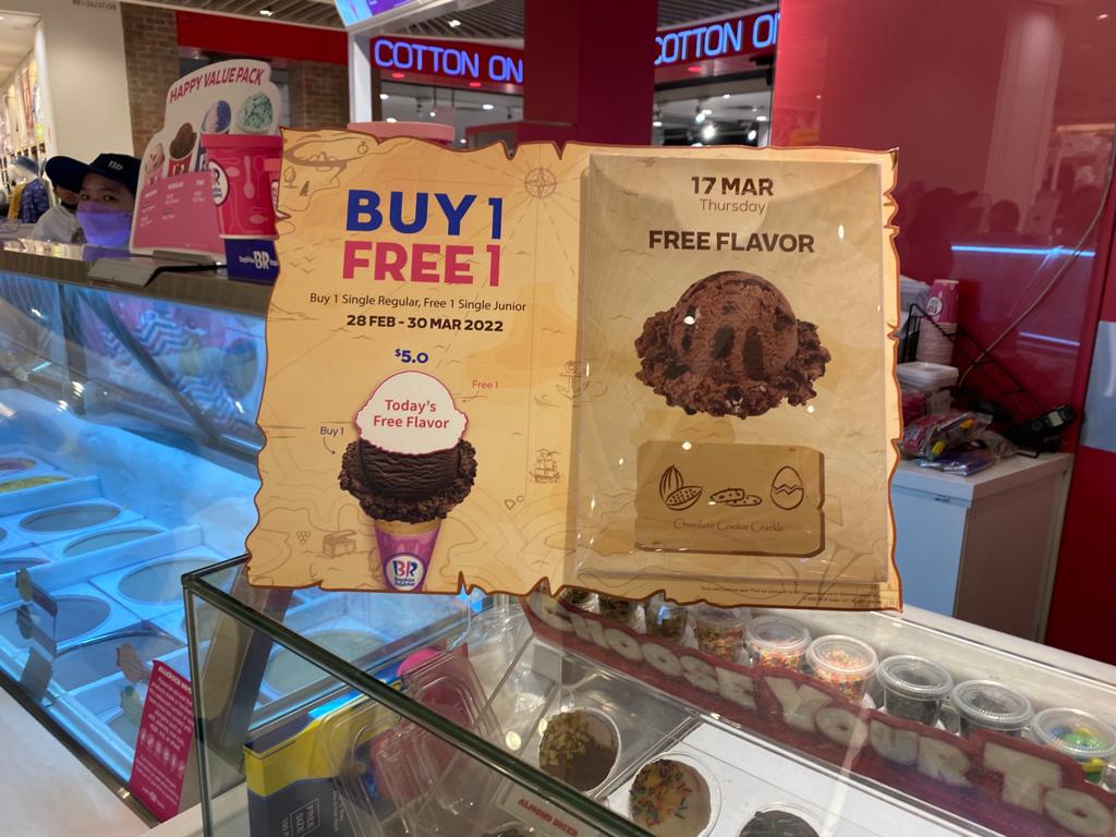 Promotional display board for Baskin-Robbins ice cream offers and free flavor.
