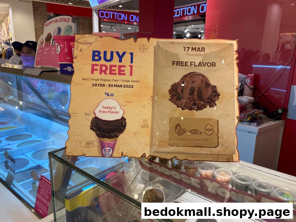 Promotional display board for Baskin-Robbins ice cream offers and free flavor.
