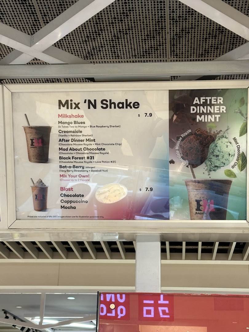 A Baskin-Robbins menu board displaying milkshakes and blasts with prices.