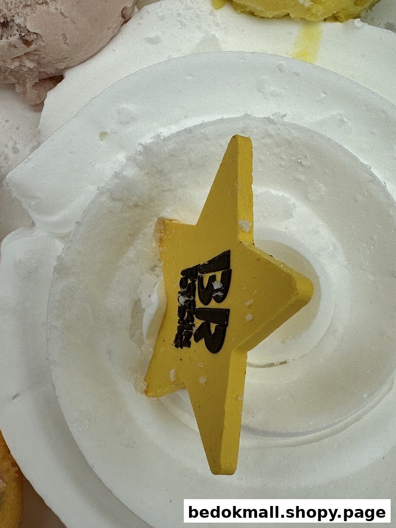 Close-up of a yellow star with 'BR' logo in white ice cream.