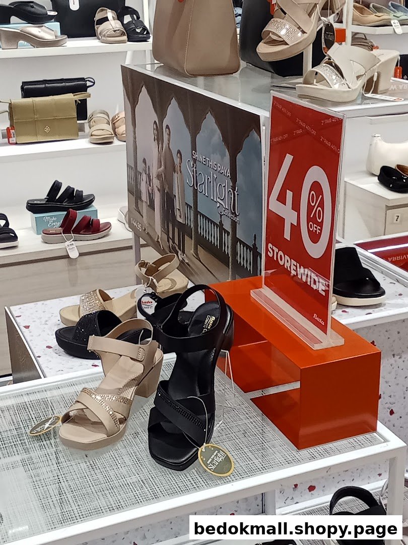 Interior shot of a Bata store displaying shoes, bags, and a 40% off sign.