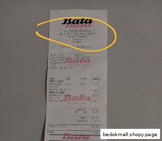 A paper retail receipt from Bata showing purchased items and total cost.