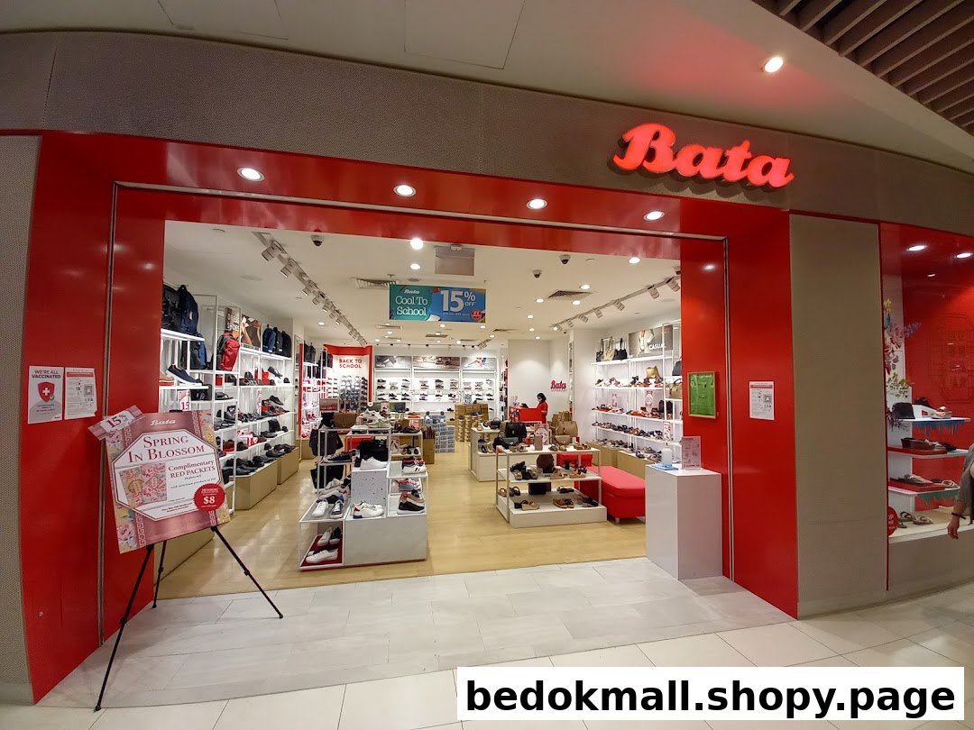 Exterior view of a Bata shoe store entrance with displays inside.