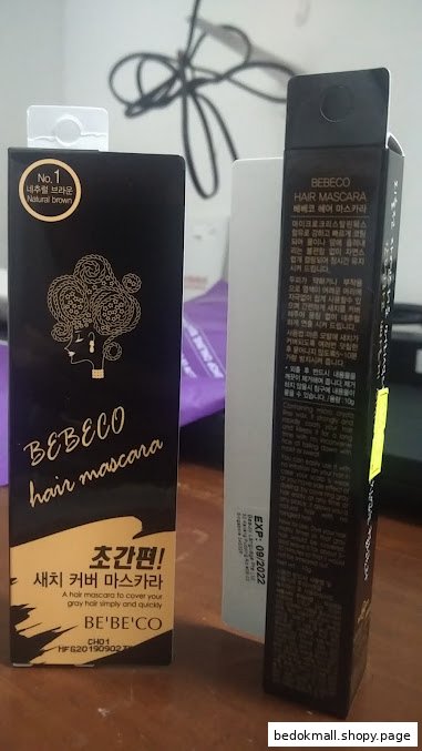 Two boxes of BEBECO hair mascara product packaging on a surface.