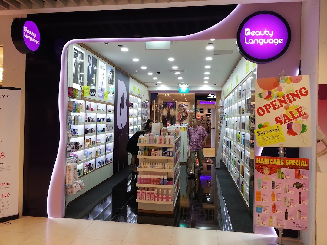 Entrance of 'Beauty Language' shop with products visible inside and promotional signs.