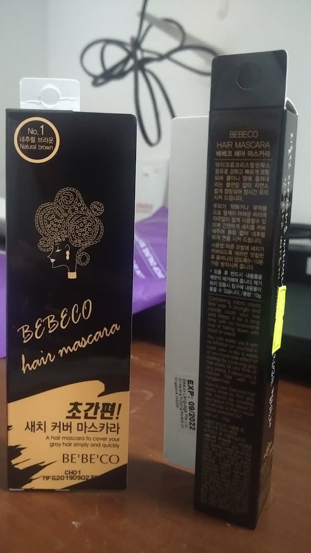 Two boxes of Bebeco hair mascara product packaging on a surface.
