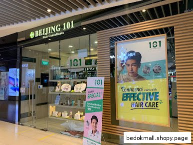 Storefront of Beijing 101 Hair Consultants with glass entrance and promotional displays.