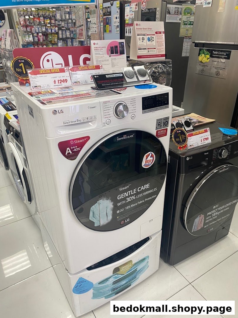 Interior shot of an electronics store displaying washing machines and refrigerators.