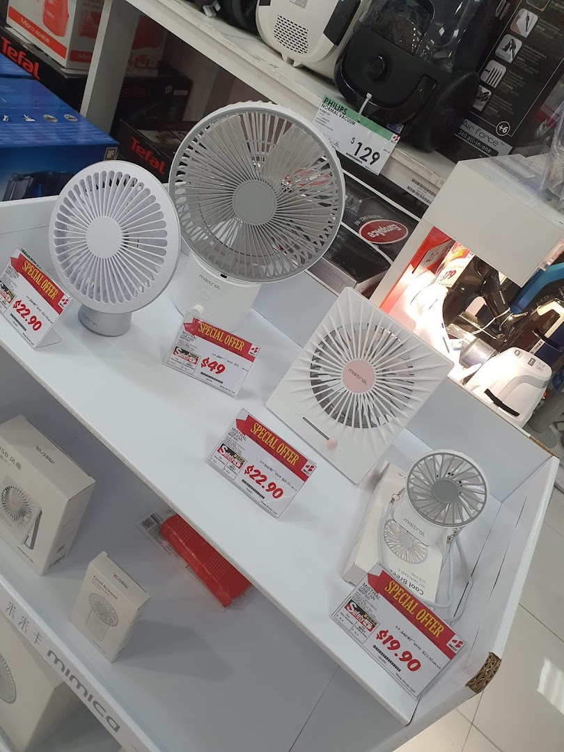 Retail display of various fans on shelves with price tags in a store.